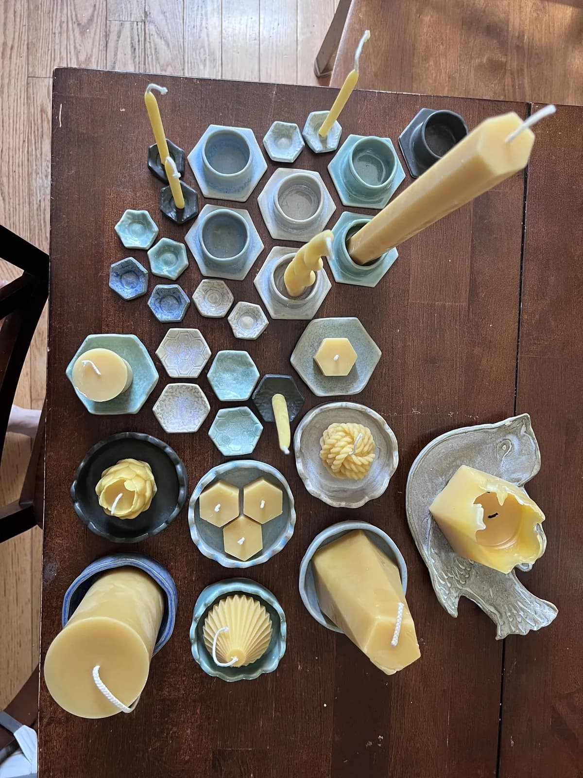 Candles and ceramics laid out on the table